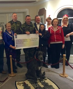Check presentation to the mayor. They even brought the barracks mascot!